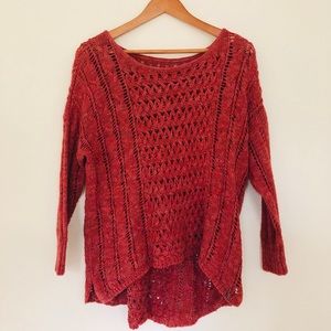 A burgundy sweater